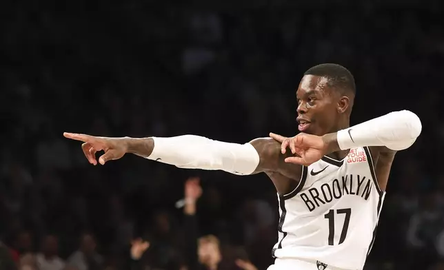 Brooklyn Nets' Dennis Schroder celebrates after scoring a three-point basket in the first half of an NBA basketball game against the Boston Celtics, Wednesday, Nov. 13, 2024, in New York. (AP Photo/Heather Khalifa)