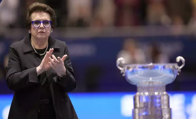 FILE - Billie Jean King applauds next to trophy during the Billie Jean King Cup finals in La Cartuja stadium in Seville, southern Spain, Sunday, Nov. 12, 2023. (AP Photo/Manu Fernandez, File)