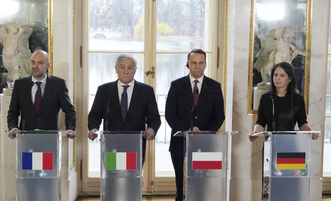 French Minister for Europe and Foreign Affairs Jean-Noel Barrot, left, Italian Foreign Minister Antonio Tajani, second left, Polish Foreign Minister Radoslaw Sikorski and German Foreign Minister Annalena Baerbock attend a press conference as European foreign ministers meet in Warsaw, Poland, Tuesday, Nov. 19, 2024. (AP Photo/Czarek Sokolowski)