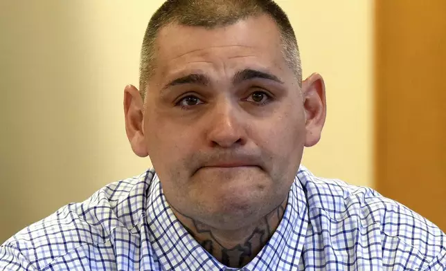 FILE - Michael Gilpatrick, a former youth detention center resident, fights back tears as testifies during a civil trial seeking to hold the state accountable for alleged abuse at the Sununu Youth Services Center, formerly called the Youth Development Center, April 17, 2024, at Rockingham County Superior Court in Brentwood, N.H. (David Lane/Union Leader via AP, Pool, File)