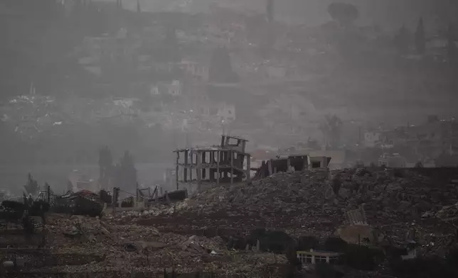 Destroyed buildings stand in the area of a village in southern Lebanon as seen from northern Israel, Monday, Nov. 25, 2024. (AP Photo/Leo Correa)