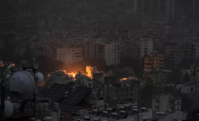 Smoke and flame rise after an Israeli airstrike on Dahiyeh, in Beirut, Lebanon, Monday, Nov. 25, 2024. (AP Photo/Bilal Hussein)