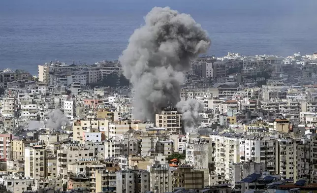 Smoke rises after an Israeli airstrike on Dahiyeh, in the southern suburb of Beirut, Lebanon, Monday, Nov. 25, 2024. (AP Photo/Bilal Hussein)