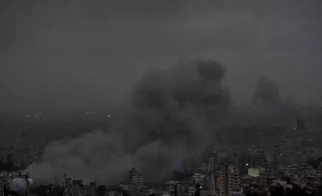 Smoke rises after an Israeli airstrike on Dahiyeh, in Beirut, Lebanon, Monday, Nov. 25, 2024. (AP Photo/Bilal Hussein)