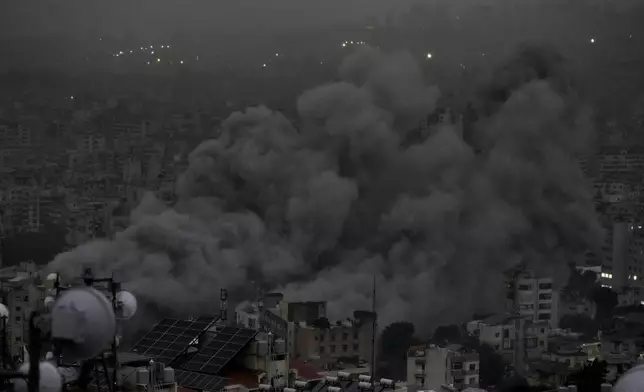 Smoke rises after an Israeli airstrike on Dahiyeh, in Beirut, Lebanon, Monday, Nov. 25, 2024. (AP Photo/Bilal Hussein)