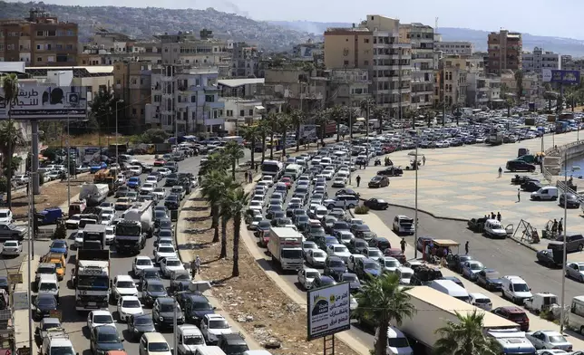 FILE - Cars sit in traffic as they flee southern villages in Sidon, Lebanon, on Sept. 23, 2024. (AP Photo/Mohammed Zaatari, File)