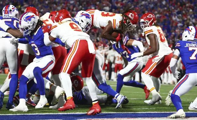 Kansas City Chiefs running back Kareem Hunt is unable to score as he leaps short of the end zone during the second half of an NFL football game against the Buffalo Bills Sunday, Nov. 17, 2024, in Orchard Park, N.Y. (AP Photo/Jeffrey T. Barnes)