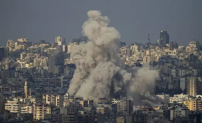 Smoke billows following Israeli airstrikes in Dahiyeh, Beirut, Lebanon, Wednesday, Nov. 13, 2024. (AP Photo/Hassan Ammar)