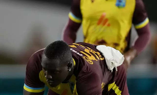 West Indies' captain Rovman Powell takes the catch to dismiss England's captain Jos Buttler during the third T20 cricket match at Daren Sammy National Cricket Stadium in Gros Islet, St. Lucia, Thursday, Nov. 14, 2024. (AP Photo/Ricardo Mazalan)