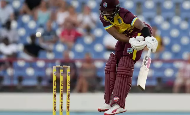 West Indies' Shai Hope plays a shot from a delivery of England's Jofra Archer during the third T20 cricket match at Daren Sammy National Cricket Stadium in Gros Islet, St. Lucia, Thursday, Nov. 14, 2024. (AP Photo/Ricardo Mazalan)