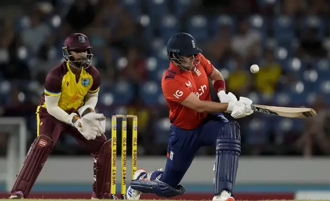 England's Liam Livingstone plays a shot against West Indies during the third T20 cricket match at Daren Sammy National Cricket Stadium in Gros Islet, St. Lucia, Thursday, Nov. 14, 2024. (AP Photo/Ricardo Mazalan)