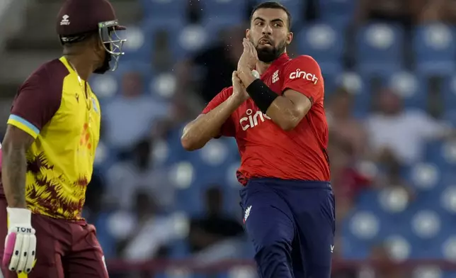 England's Saqib Mahmood bowls against West Indies during the third T20 cricket match at Daren Sammy National Cricket Stadium in Gros Islet, St.Lucia, Thursday, Nov. 14, 2024. (AP Photo/Ricardo Mazalan)