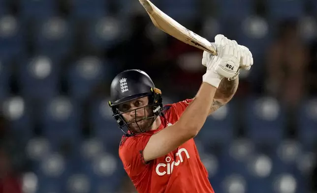 England's Phil Salt plays a shot against West Indies during the third T20 cricket match at Daren Sammy National Cricket Stadium in Gros Islet, St. Lucia, Thursday, Nov. 14, 2024. (AP Photo/Ricardo Mazalan)