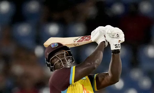 West Indies' captain Rovman Powell plays a shot against England during the third T20 cricket match at Daren Sammy National Cricket Stadium in Gros Islet, St. Lucia, Thursday, Nov. 14, 2024. (AP Photo/Ricardo Mazalan)