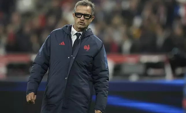 France's coach Fabien Galthie watches his team warm-up for the Autumn Nations series rugby union match between France and Japan at the Stade de France in Saint-Denis, outside Paris, Saturday, Nov. 9, 2024. (AP Photo/Christophe Ena)