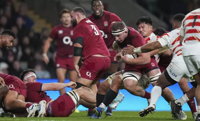 England's Sam Underhill runs to score a try during the Autumn Nations Series rugby union match between England and Japan at the Allianz Stadium Twickenham in London, Sunday, Nov. 24, 2024. (AP Photo/Alastair Grant)