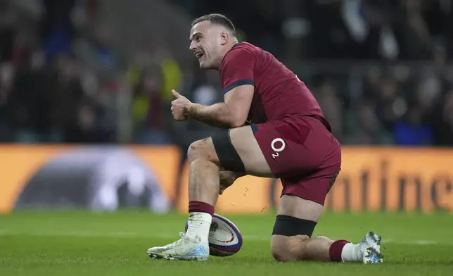 England's Ben Earl celebrates after scoring a try during the Autumn Nations Series rugby union match between England and Japan at the Allianz Stadium Twickenham in London, Sunday, Nov. 24, 2024. (AP Photo/Alastair Grant)