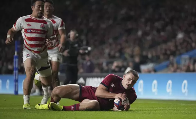 England's Ollie Sleightholme scores a try during the Autumn Nations Series rugby union match between England and Japan at the Allianz Stadium Twickenham in London, Sunday, Nov. 24, 2024. (AP Photo/Alastair Grant)