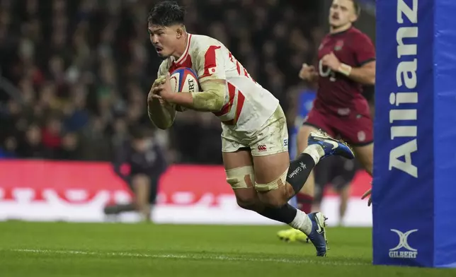 Japan's Kazuki Himeno goes to score a try during the Autumn Nations Series rugby union match between England and Japan at the Allianz Stadium Twickenham in London, Sunday, Nov. 24, 2024. (AP Photo/Alastair Grant)