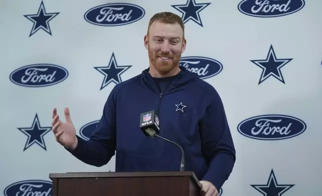 Dallas Cowboys quarterback Cooper Rush answers questions during a press conference after an NFL football game against the Washington Commanders, Sunday, Nov. 24, 2024, in Landover, Md. The Cowboys won 34-26. (AP Photo/Stephanie Scarbrough)