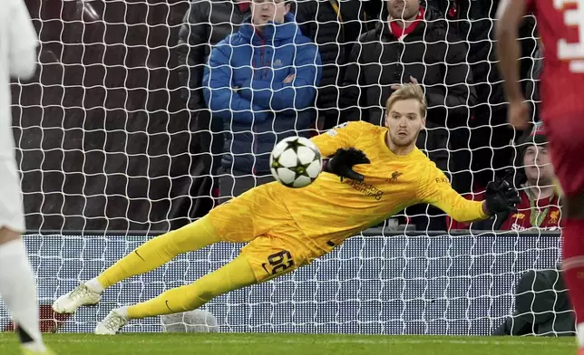 Liverpool's goalkeeper Caoimhin Kelleher stops a penalty shot from Real Madrid's Kylian Mbappe during the Champions League opening phase soccer match between Liverpool and Real Madrid at Anfield Stadium, Liverpool, England, Wednesday, Nov. 27, 2024. (AP Photo/Jon Super)