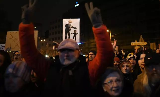 Thousands of protesters gather to mark the 35th anniversary of the Velvet Revolution, that brought an end to decades of communist rule in Czechoslovakia, and to oppose the policies of populist Prime Minister Robert Fico, in Bratislava, Slovakia, Sunday, Nov. 17, 2024. (AP Photo/Petr David Josek)