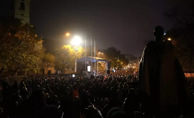 Thousands of protesters gather to mark the 35th anniversary of the Velvet Revolution, that brought an end to decades of communist rule in Czechoslovakia, and to oppose the policies of populist Prime Minister Robert Fico, in Bratislava, Slovakia, Sunday, Nov. 17, 2024. (AP Photo/Petr David Josek)