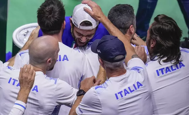 Italy's Matteo Berrettini celebrates after winning against Australia's Thanasi Kokkinakis during the Davis Cup semifinal at the Martin Carpena Sports Hall in Malaga, southern Spain, on Saturday, Nov. 23, 2024. (AP Photo/Manu Fernandez)