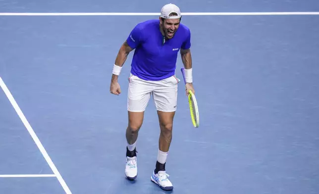 Italy's Matteo Berrettini celebrates after winning against Australia's Thanasi Kokkinakis during the Davis Cup semifinal at the Martin Carpena Sports Hall in Malaga, southern Spain, on Saturday, Nov. 23, 2024. (AP Photo/Manu Fernandez)