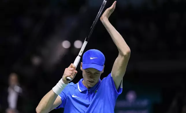 Italy's Jannik Sinner celebrates a point against Argentina's Sebastian Baez during a Davis Cup quarterfinal match at the Martin Carpena Sports Hall in Malaga, southern Spain, on Thursday, Nov. 21, 2024. (AP Photo/Manu Fernandez)