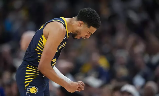 Indiana Pacers' Tyrese Haliburton reacts after hitting a 3-point shot during the second half of an NBA basketball game against the New Orleans Pelicans, Monday, Nov. 25, 2024, in Indianapolis. (AP Photo/Darron Cummings)