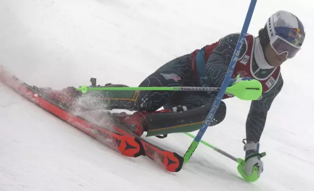 Brazil' Lucas Braathen speeds down the course during an alpine ski, men's World Cup slalom, in Levi, Finland, Sunday, Nov. 17, 2024. (AP Photo/Marco Trovati)