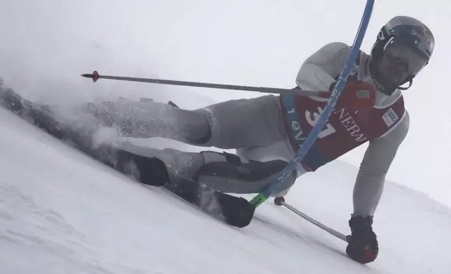 Netherland's Marcel Hirscher speeds down the course during an alpine ski, men's World Cup slalom, in Levi, Finland, Sunday, Nov. 17, 2024. (AP Photo/Marco Trovati)