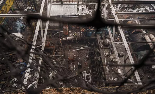 Production hall is seen destroyed though the roof after a recent Russian missile attack at DTEK's power plant in Ukraine, Nov. 28, 2024. (AP Photo/Evgeniy Maloletka)