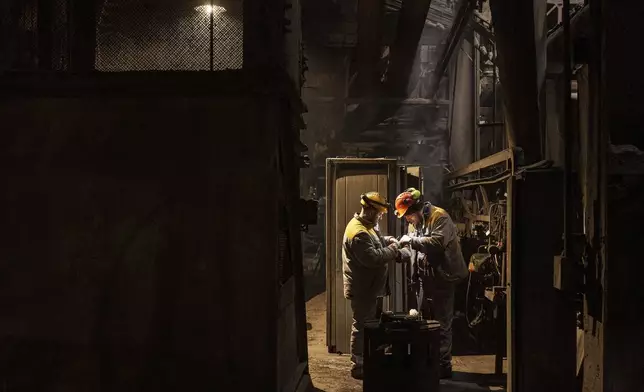 Worker repair equipment at DTEK's power plant after a recent Russian missile attack in Ukraine, Nov. 28, 2024. (AP Photo/Evgeniy Maloletka)