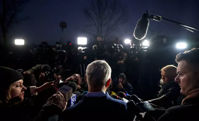 Calin Georgescu independent candidate in the presidential elections speaks to media, in Izvorani, Romania, Tuesday, Nov. 26, 2024, after making it into the December 8 election runoff. (AP Photo/Andreea Alexandru)