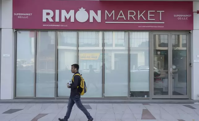 A man walks past Rimon Market, a Kosher grocery store managed by the late Rabbi Zvi Kogan, in Dubai, United Arab Emirates, Sunday, Nov. 24, 2024. (AP Photo/Jon Gambrell)