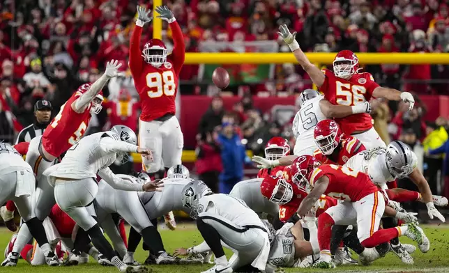 Las Vegas Raiders place kicker Daniel Carlson (2) misses a field goal late in the fourth quarter against the Kansas City Chiefs in an NFL football game in Kansas City, Mo., Friday, Nov. 29, 2024. (AP Photo/Ed Zurga)