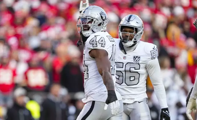 Las Vegas Raiders defensive end K'Lavon Chaisson (44) celebrates after a sack against the Kansas City Chiefs during the first half of an NFL football game in Kansas City, Mo., Friday, Nov. 29, 2024. (AP Photo/Ed Zurga)