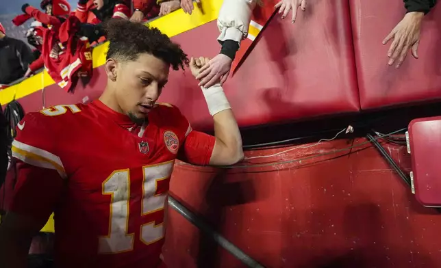 Kansas City Chiefs quarterback Patrick Mahomes (15) greets fan following an NFL football game against the Las Vegas Raiders in Kansas City, Mo., Friday, Nov. 29, 2024. (AP Photo/Charlie Riedel)