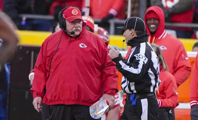 Kansan city Chiefs head coach Andy Reid talks with side judge Dave Hawkshaw (107) during the first half of an NFL football game against the Las Vegas Raiders in Kansas City, Mo., Friday, Nov. 29, 2024. (AP Photo/Charlie Riedel)