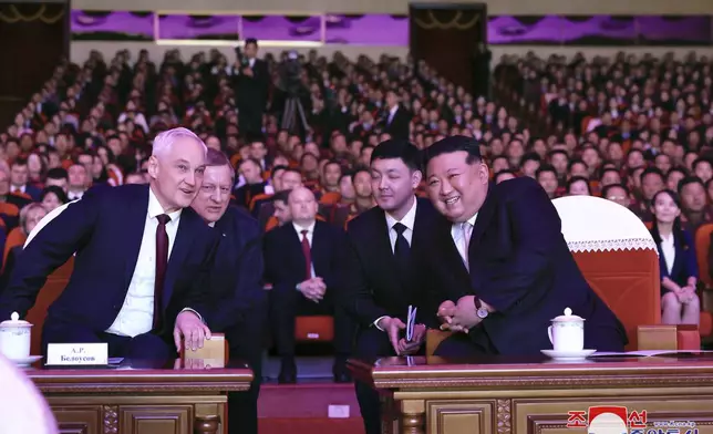 In this photo provided by the North Korean government, North Korean leader Kim Jong Un, right, and Russian Defense Minister Andrei Belousov, left, watch a performance to welcome Russian military delegation in Pyongyang, North Korea Friday, Nov. 29, 2024. Independent journalists were not given access to cover the event depicted in this image distributed by the North Korean government. The content of this image is as provided and cannot be independently verified. Korean language watermark on image as provided by source reads: "KCNA" which is the abbreviation for Korean Central News Agency. (Korean Central News Agency/Korea News Service via AP)