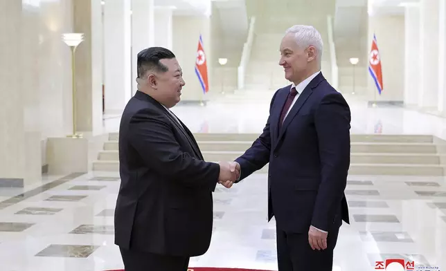 In this photo provided by the North Korean government, North Korean leader Kim Jong Un, left, shakes hands with Russian Defense Minister Andrei Belousov in Pyongyang, North Korea Friday, Nov. 29, 2024. Independent journalists were not given access to cover the event depicted in this image distributed by the North Korean government. The content of this image is as provided and cannot be independently verified. Korean language watermark on image as provided by source reads: "KCNA" which is the abbreviation for Korean Central News Agency. (Korean Central News Agency/Korea News Service via AP)