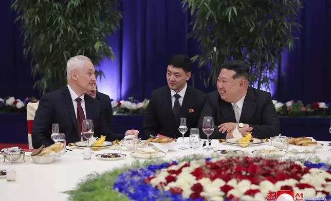 In this photo provided by the North Korean government, North Korean leader Kim Jong Un, right, and Russian Defense Minister Andrei Belousov, left, talk during a banquet to welcome Russian military delegation in Pyongyang, North Korea Friday, Nov. 29, 2024. Independent journalists were not given access to cover the event depicted in this image distributed by the North Korean government. The content of this image is as provided and cannot be independently verified. Korean language watermark on image as provided by source reads: "KCNA" which is the abbreviation for Korean Central News Agency. (Korean Central News Agency/Korea News Service via AP)