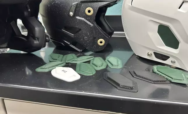 A 3D printer creates helmet inserts at Michigan State University's Biomechanical Design Research Laboratory, Monday, Nov. 18, 2024, in East Lansing, Mich. (AP Photo/Mike Householder)