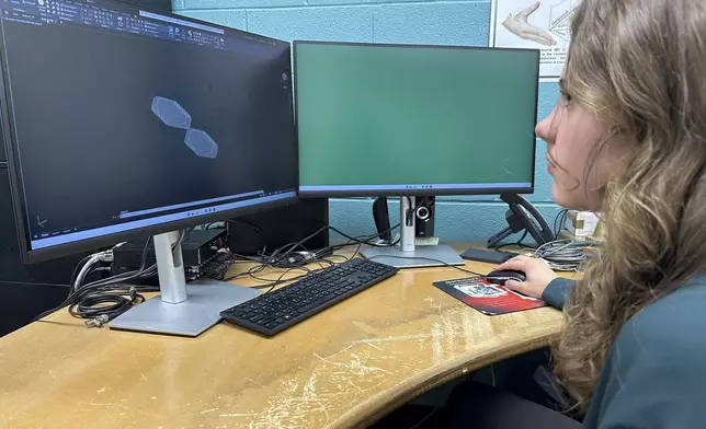 Rylie DuBois, a sophomore biosystems engineering major at Michigan State University, uses a computer-aided design program at the school's Biomechanical Design Research Laboratory, Monday, Nov. 18, 2024, in East Lansing, Mich. (AP Photo/Mike Householder)