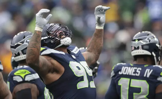 Seattle Seahawks defensive end Leonard Williams (99) celebrates a sack during an NFL football game against the Arizona Cardinals, Sunday, Nov. 24, 2024, in Seattle. (AP Photo/Jason Redmond)