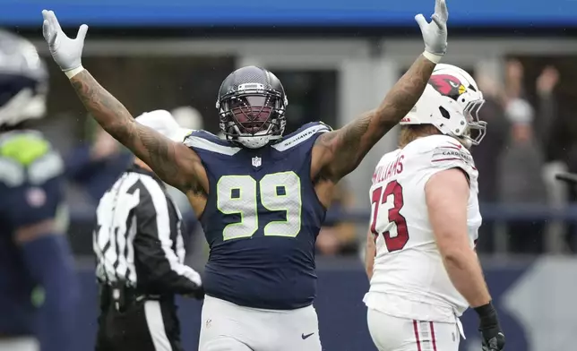 Seattle Seahawks defensive end Leonard Williams (99) celebrates a sack during an NFL football game against the Arizona Cardinals, Sunday, Nov. 24, 2024, in Seattle. (AP Photo/Stephen Brashear)