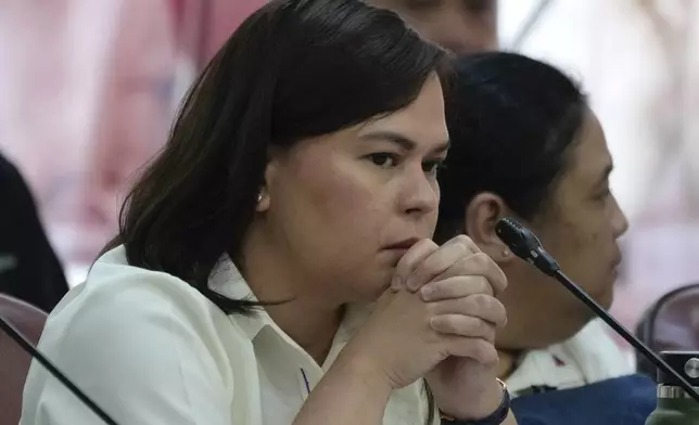 Philippine Vice President Sara Duterte listens as she attends a hearing at the House of Representative in Quezon City, Philippines on Monday Nov. 25, 2024. (AP Photo/Aaron Favila)