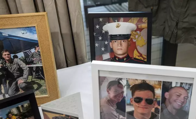 FILE - Photographs of Marine Cpl. Spencer R. Collart and his fellow marines, Capt. Eleanor V. LeBeau, bottom left, and Maj. Tobin J. Lewis, bottom right, are seen at the home of his parents in Arlington, Va., June 19, 2024. Collart, 21, was killed along with the two Marines when the MV-22B Osprey aircraft they were on crashed during drills on a north Australian island on Aug. 27, 2023. (AP Photo/Rod Lamkey, Jr.)